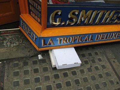 boxes wedged under shop frontage